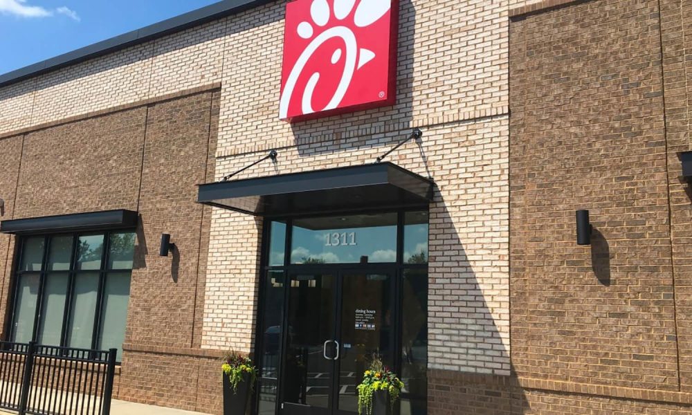 A picture containing text, building, outdoor, brick
Description automatically generated