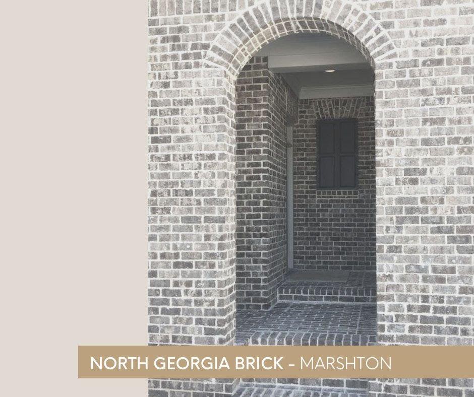 A picture containing text, building, brick, arch
Description automatically generated