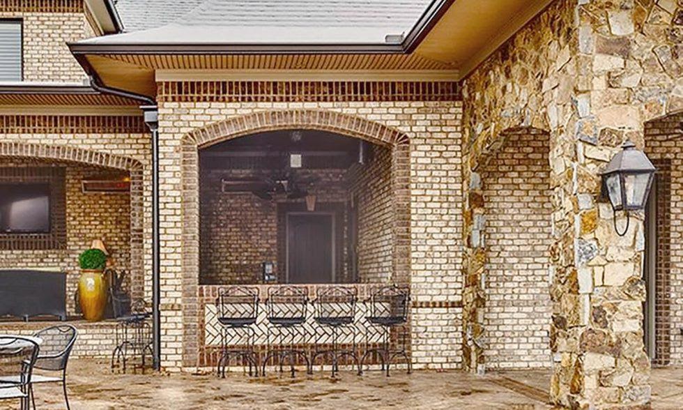 A picture containing building, stone, furniture
Description automatically generated