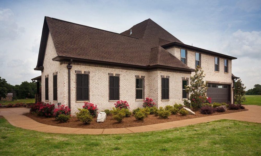 A picture containing grass, sky, outdoor, building
Description automatically generated