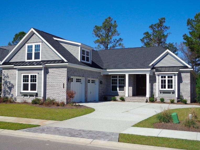 A house with a driveway
Description automatically generated with low confidence