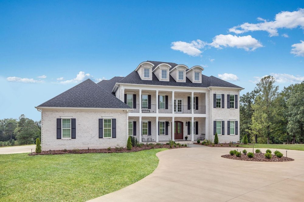 A picture containing grass, outdoor, sky, house
Description automatically generated