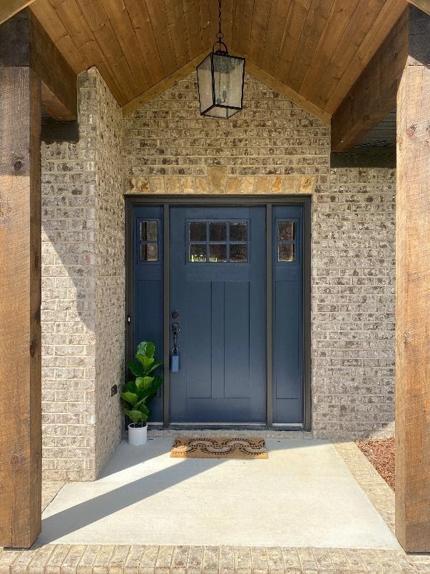 A blue door in a stone building
Description automatically generated with medium confidence