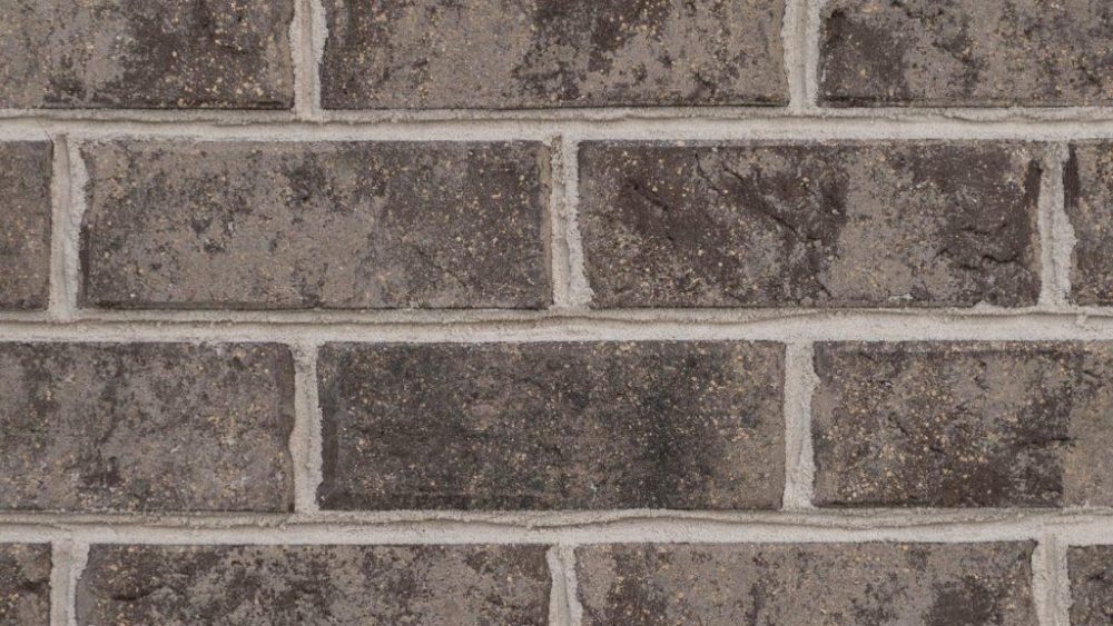 A picture containing brick, stone, building material, tiled
Description automatically generated