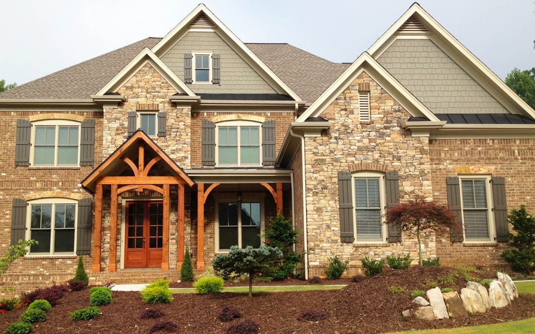 Home front in red brick and natural stone veneer from North Georgia Brick